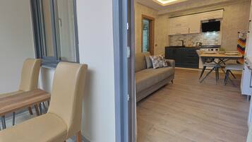 Junior Suite, Balcony, Mountain View | Living area | TV