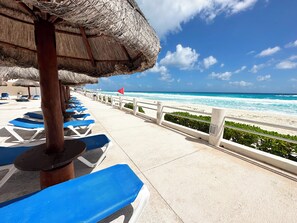 On the beach, sun-loungers, beach towels