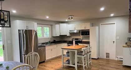 River front 4 season cottage with 2.5 acre serenity with mature trees around