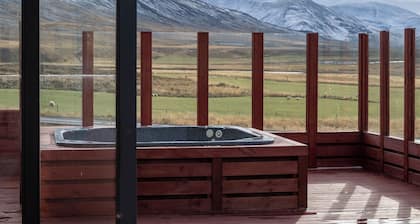 Peace and quiet surrounding mountains and a river view.