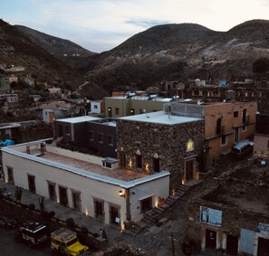 A town with buildings of various architectural styles, including stone and modern structures. - Hotel La Tarjea (Real de Catorce)