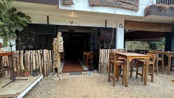 Welcome to Restaurant Karakoke Disco Bar, where guests can enjoy a rustic dining experience.