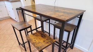 A kitchen with a large wooden table and two matching stools. - Beverlywood 2 bedroom guesthouse. 5 minutes to Rodeo Drive!  (Beverly Hills)
