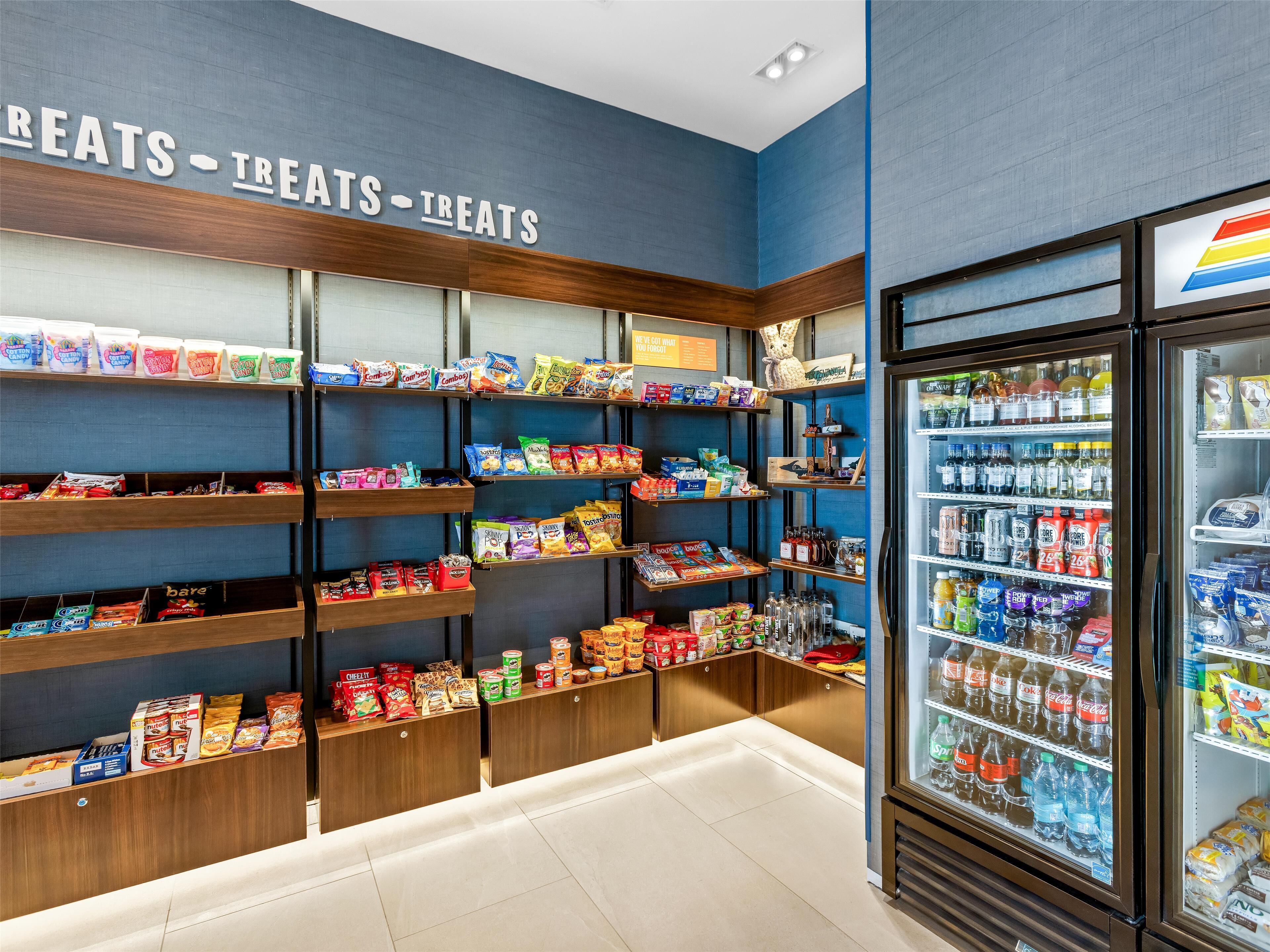 A snack and beverage display area with various packaged snacks and drinks.