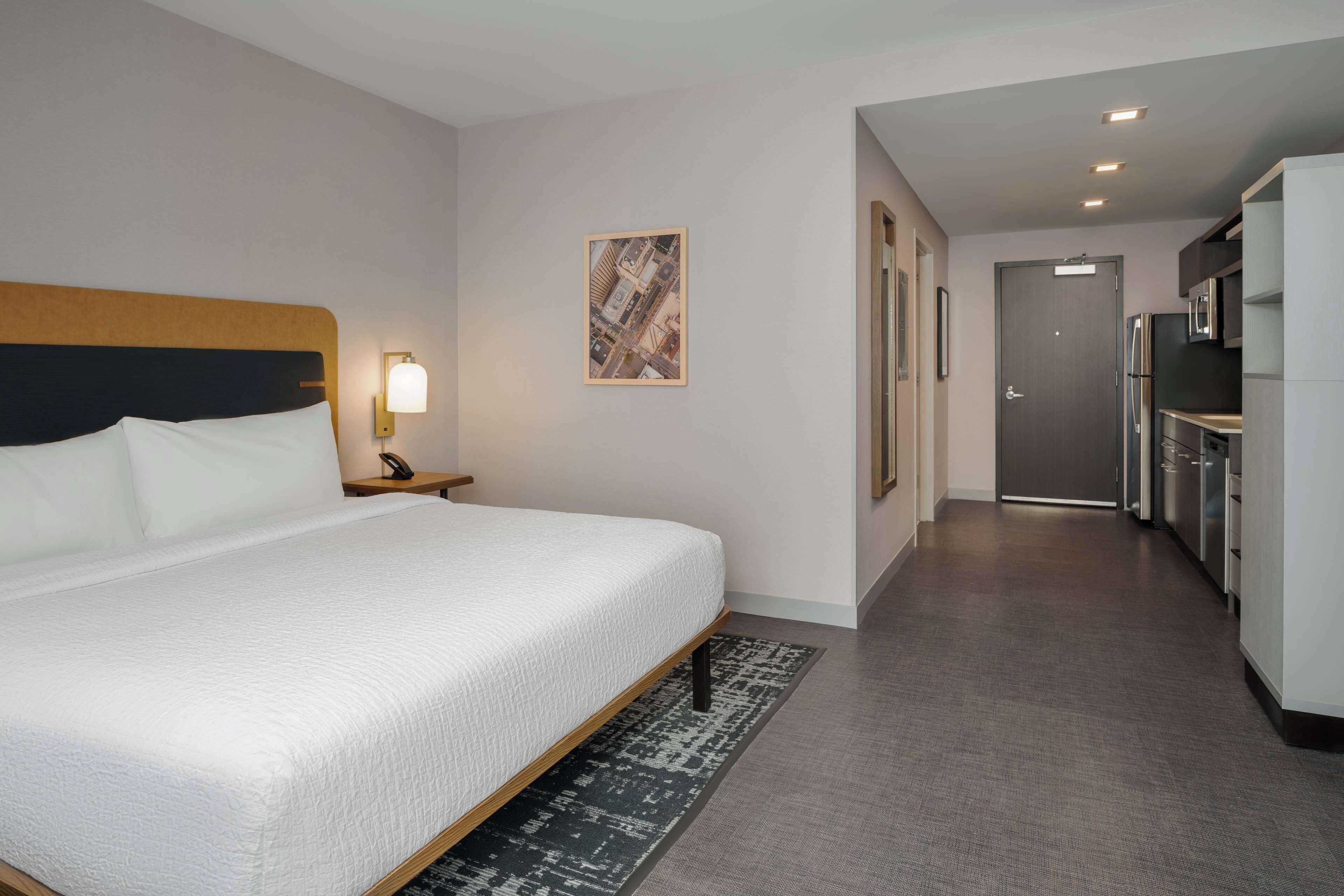 Suite, 1 King Bed (Efficiency) | Desk, laptop workspace, blackout curtains, iron/ironing board