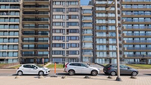 A modern apartment building with multiple floors and balconies. - Studio on the 5th Floor With a Beautiful View (Middelkerke)