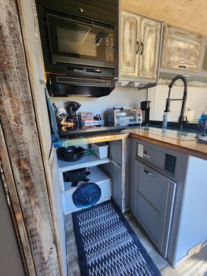 Fridge, microwave, stovetop, coffee/tea maker