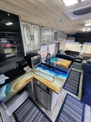 Fridge, microwave, stovetop, coffee/tea maker