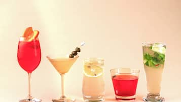 Five different types of drinks in various glassware.