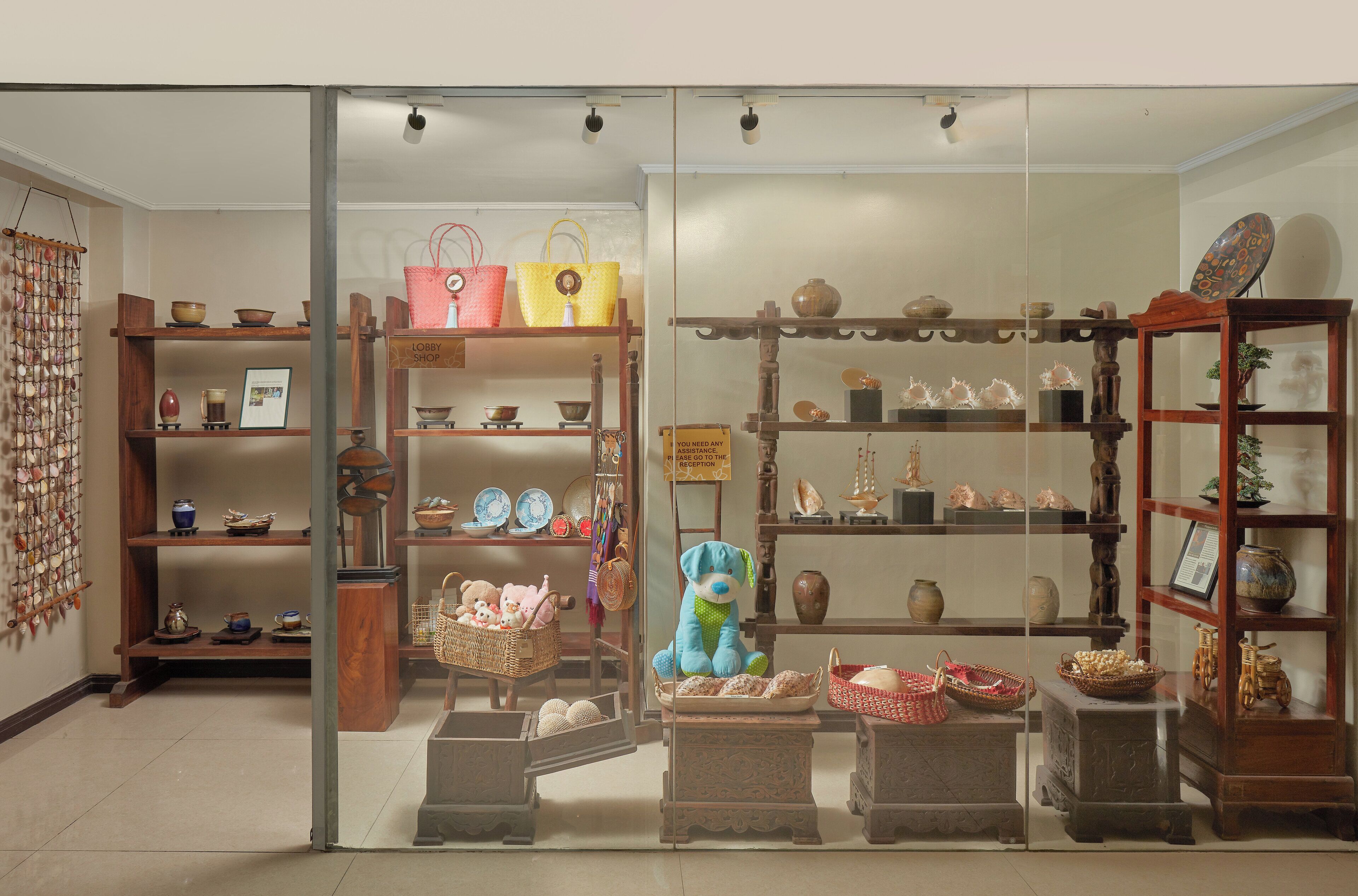 A display of various pottery and baskets in a shop setting.