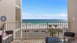 A balcony with a view of a beach and ocean. - Beach Lovers Dream- 2 BR Majestic Sun Condo Sleeps 8! (Destin)