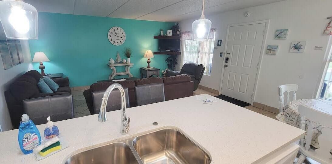 A compact living space with a kitchenette, a dining area, and a seating area.