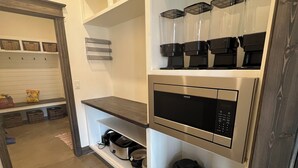 A kitchen with built-in appliances including a microwave, coffee maker, and blender. - Cozy retreat located in the perfect location for views of the mountains and lake (Eagle Nest)