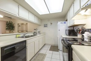 Condo, Multiple Beds, Balcony, Pool View (Padre Oasis #302) | Private kitchen | Fridge, microwave, oven, stovetop