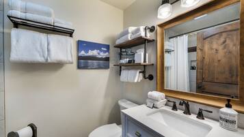 Shower, hair dryer, towels, soap