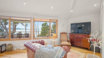 Design House, Bay View | Living area | 50-inch Smart TV with digital channels, Netflix, Hulu