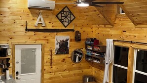 A cozy cabin interior with a wooden interior, a dining area, a sofa, and a ceiling fan. - The LucKY Lodge: Hot Tub! New Build, 11 Miles to Natural Bridge (Campton)