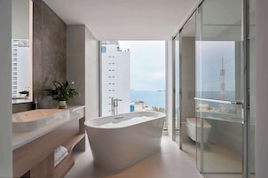 Designer toiletries, hair dryer, bathrobes, slippers
