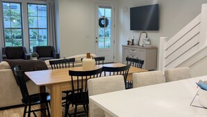 A modern living room with a dining area, a kitchen, and a staircase. - Back To College! 3 Bed Rooms 2.5 Bathroom- College Street near 280 (Auburn)