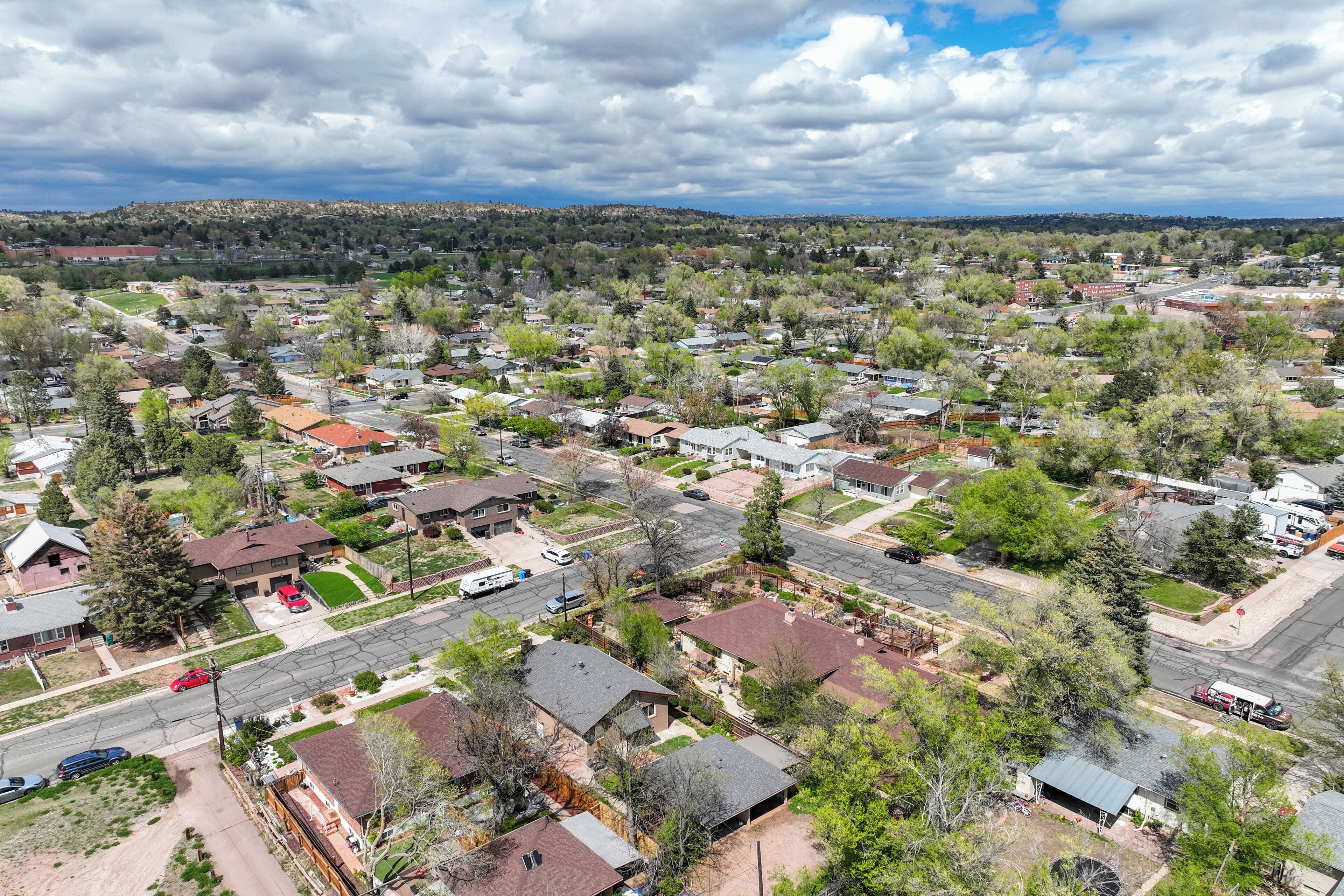 An aerial view of a residential neighborhood with houses, streets, and greenery.