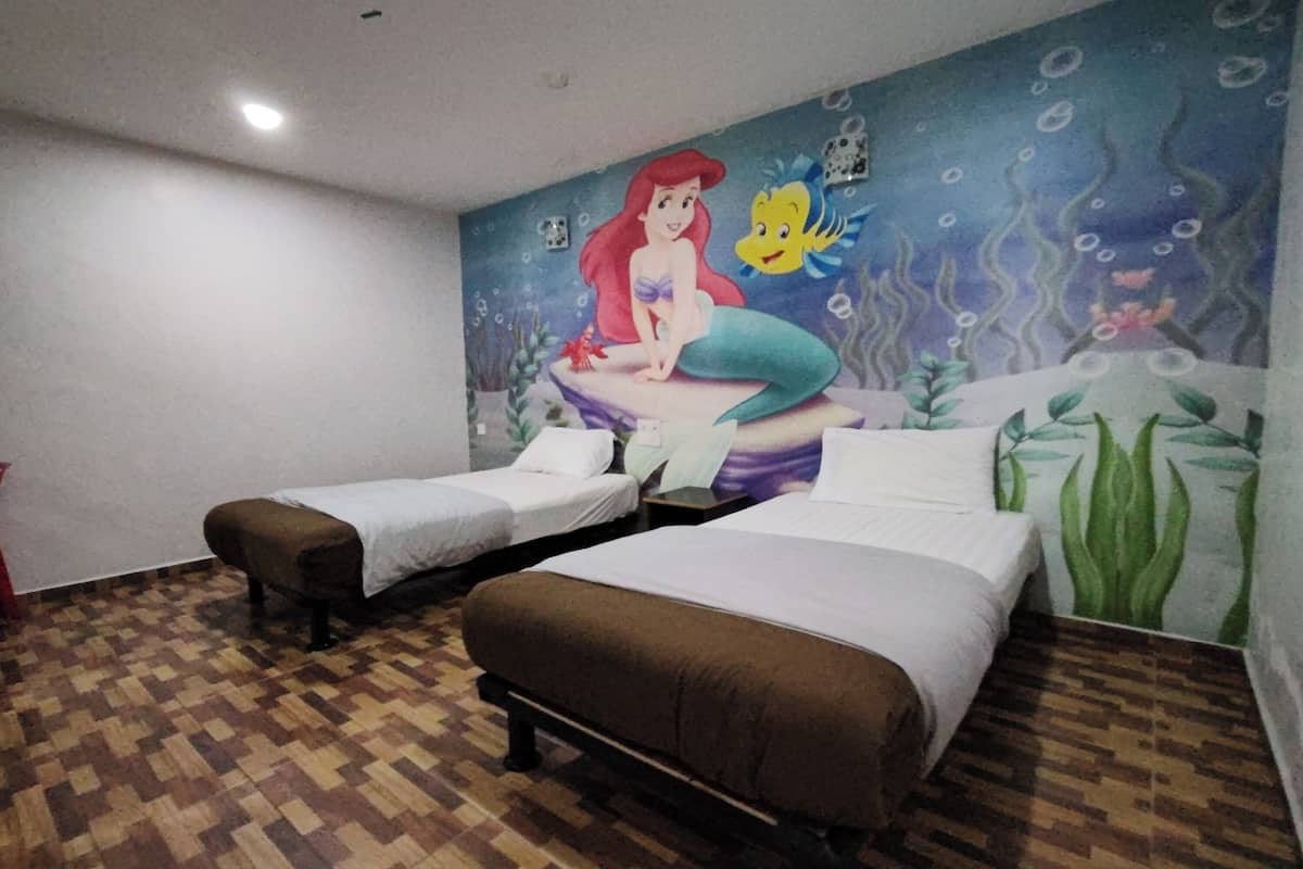 A room with two beds, a mural of a mermaid, and a patterned floor.