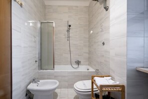 Hair dryer, bidet, towels, toilet paper