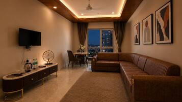 Suite with Living Room | Living area | 1-inch LED TV with satellite channels