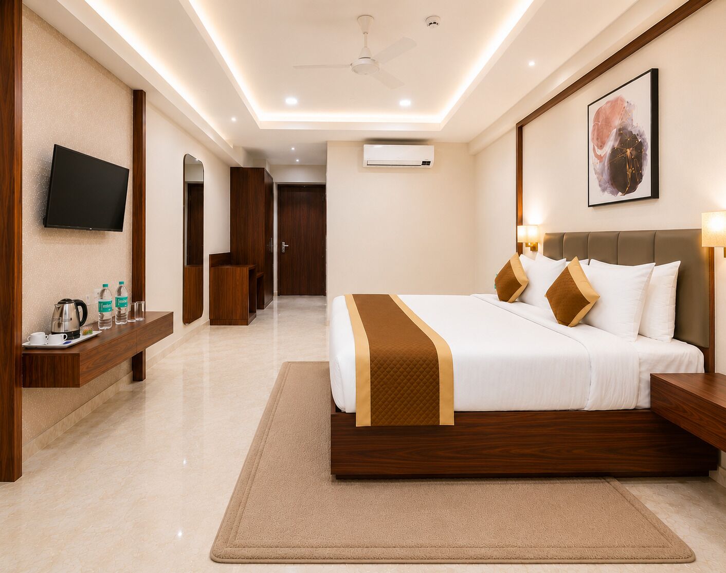 A modern hotel room with a large bed, bedside tables, a flat-screen TV, a coffee maker, and a water dispenser.