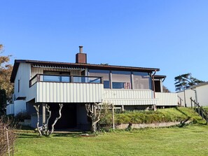 A modern two-story house with a flat roof, large windows, and a chimney. - 6 Person Holiday Home in Skummeslovsstrand (Skummesloevsstrand)