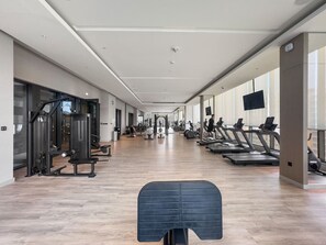 Fitness facility - Stylish 1BR Family Stay with Balcony, Gym, and Pool Access (Meydan)