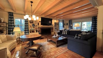 Smart TV, fireplace, books, printers