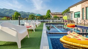 Relax by the rooftop pool overlooking the majestic mountains.