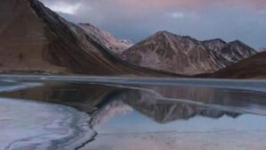 A tranquil mountain landscape with a reflective lake. - Padma Cottage Pangong (Leh)