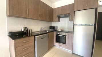 Apartment, Non Smoking, Pool View | Private kitchen | Highchair