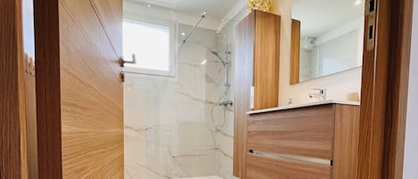 Shower, hair dryer, towels, soap