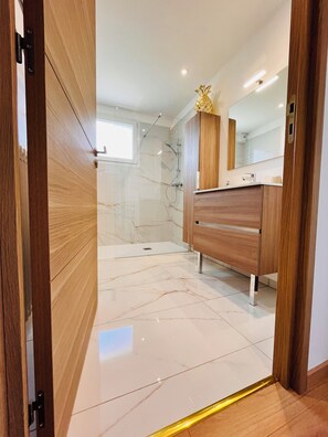 Shower, hair dryer, towels, soap