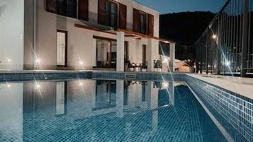 Seasonal outdoor pool, pool umbrellas, pool loungers