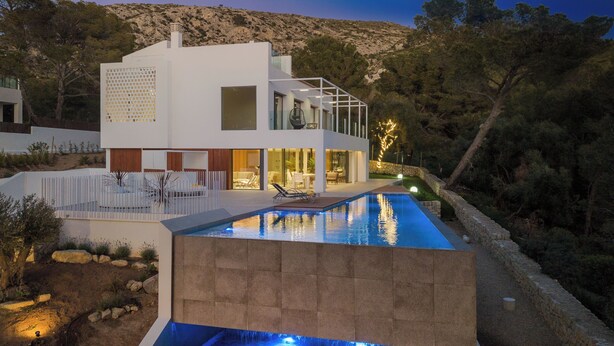 A modern house with a swimming pool, outdoor seating, and a view of the surrounding landscape. - Villa Sky - private swimming pool and terrace (Alcudia)