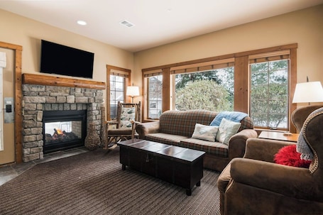 TV, fireplace, books. Basin Creekside Escape – Ski-In/Ski-Out Boyne Mt