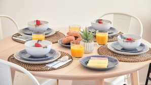 A breakfast setting with bowls, plates, glasses of orange juice, and pastries on a round table. - Enjoy The Sunny Balcony, By Timecooler (Lisbon)