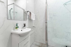 Shower, hair dryer, towels, soap