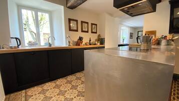 Villa | Private kitchen | Fridge, microwave, oven, stovetop