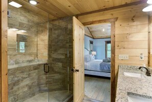 Shower, hair dryer, towels, shampoo