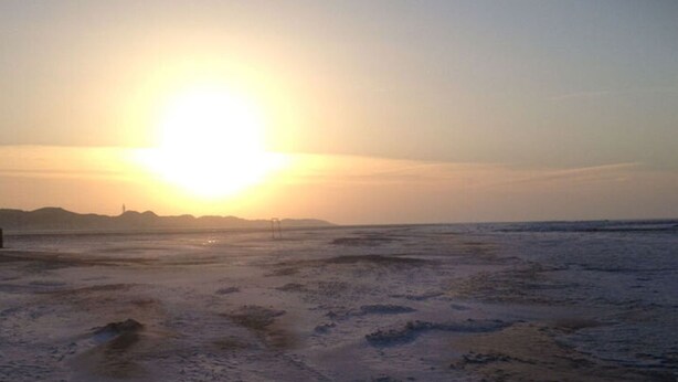 A beach with a sunset. - Pleasant Apartment in Suddorf (Nebel)