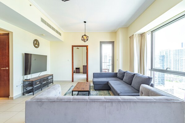 Classic Apartment, Balcony, City View | Living area | 55-inch Smart TV with cable channels, Netflix, streaming services - SuperHost - Chic Downtown Living 1BR in Dubai's South Ridge 5 (Dubai)