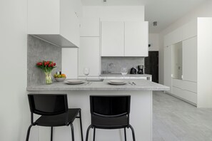 Studio, Balcony | Private kitchen | Oven, electric kettle, freezer, paper towels - Comfortable Studio Apartments by Renters (Szczecin)