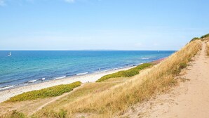 A coastal path leading to a beach with clear skies and calm sea. - 6 Person Holiday Park Home in Gilleleje (Gilleleje)