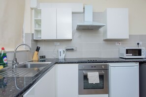 Apartment | Private kitchen | Fridge, microwave, oven, stovetop