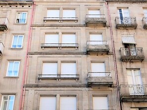 A multi-story building with balconies and large windows. - Apartment in Ourense Near Thermal Baths (Ourense)