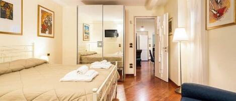 1 bedroom, desk, iron/ironing board, travel crib